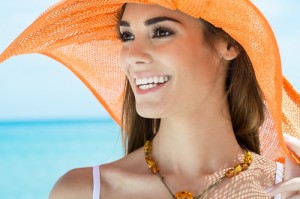 Happy Woman With Orange Hat At Beach