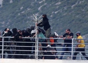 Fans-of-PAOK-Salonika-and-AEK-Athens-clash-before-the-Greek-Cup-Final-soccer-game-at-Panthessaliko-s